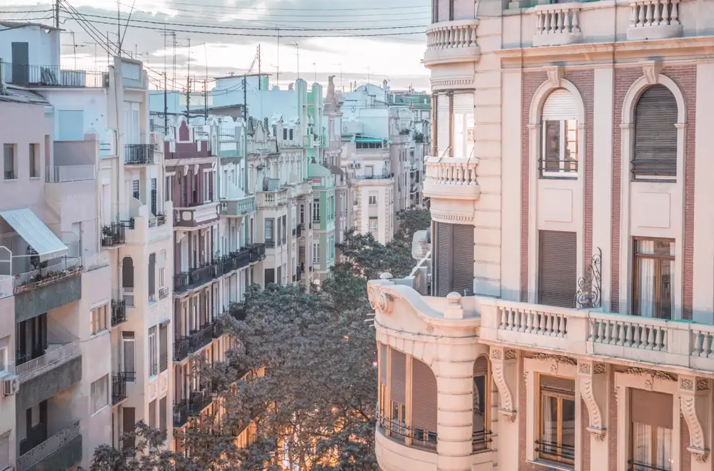 The Turia riverbed park curving through Valencia with the old town beyond
