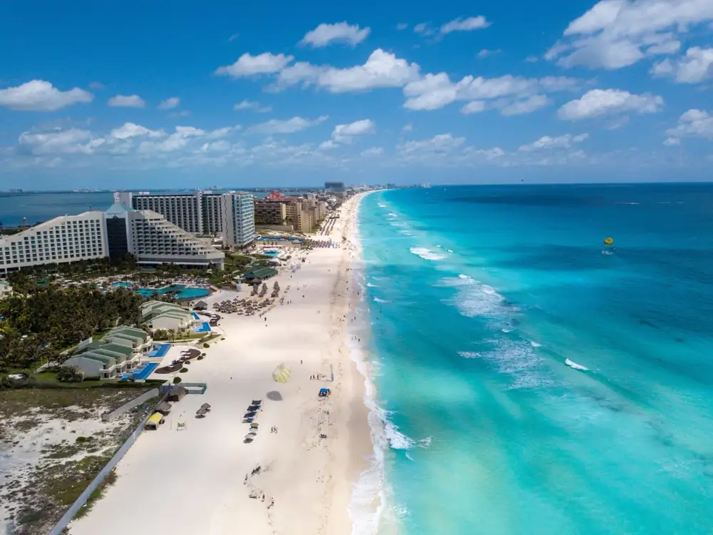 Flat turquoise water on the sheltered northern beach of the Cancun hotel zone